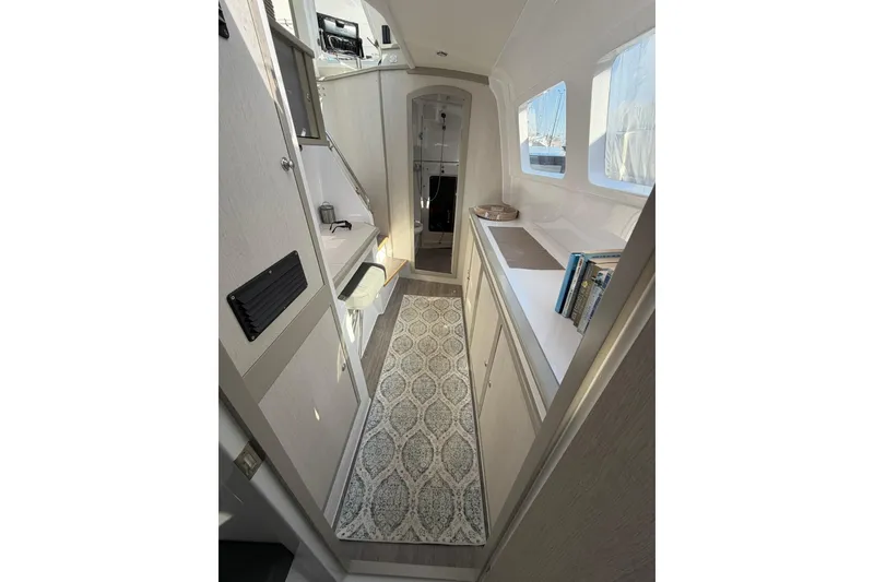 Slide: The Image of Interior of 2022 Seawind 1160 Lite catamaran, featuring modern design and ample natural light. - 13