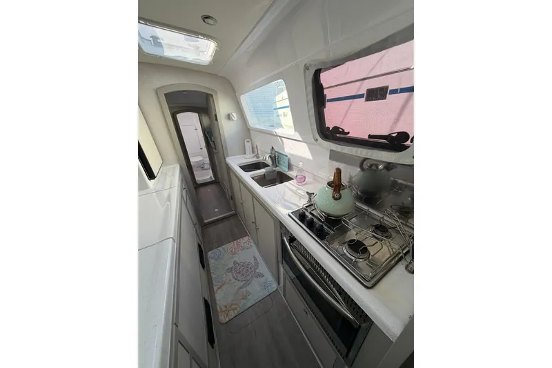 Slide: The Image of Modern kitchen interior of 2022 Seawind 1160 Lite catamaran with diesel motors. - 14