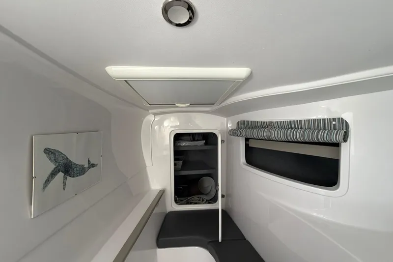 Slide: The Image of Interior of 2022 Seawind 1160 Lite yacht, featuring modern design and whale artwork. - 23