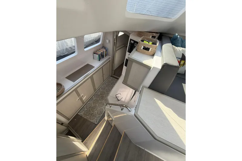 Slide: The Image of Interior of 2022 Seawind 1160 Lite catamaran, featuring modern design and ample natural light. - 26