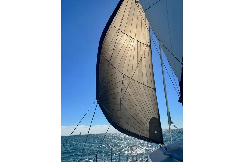 Slide: The Image of Sailing on a 2022 Seawind 1160 Lite with Diesel Motors, sunlit sail, ocean view. - 8