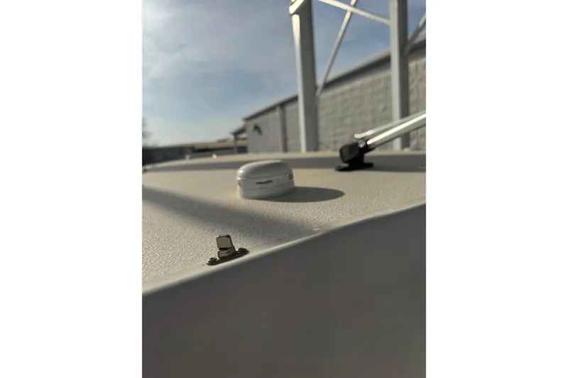 Slide: The Image of 2023 Sea Hunt Ultra 305 SE boat deck with hardware and clear sky background. - 14