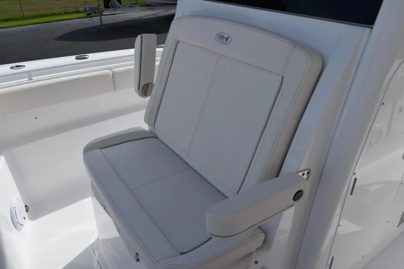 Slide: The Image of 2023 Sea Hunt Ultra 305 SE boat seat with armrests, showcasing luxury and comfort. - 15