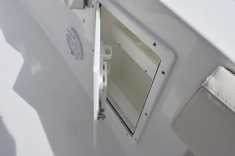 Slide: The Image of Open storage compartment on 2023 Sea Hunt Ultra 305 SE boat interior. - 28