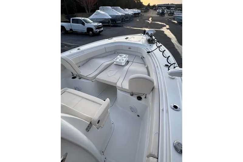 Slide: The Image of 2023 Sea Hunt Ultra 305 SE boat with spacious seating and modern design. - 7
