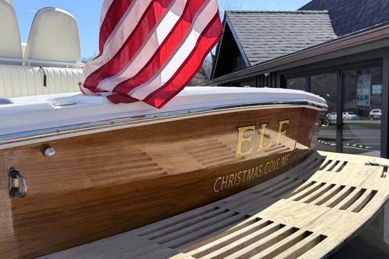 Slide: The Image of 2008 Hunt Yachts Surfhunter 25 Center Console with American flag, docked at Christmas Cove. - 10