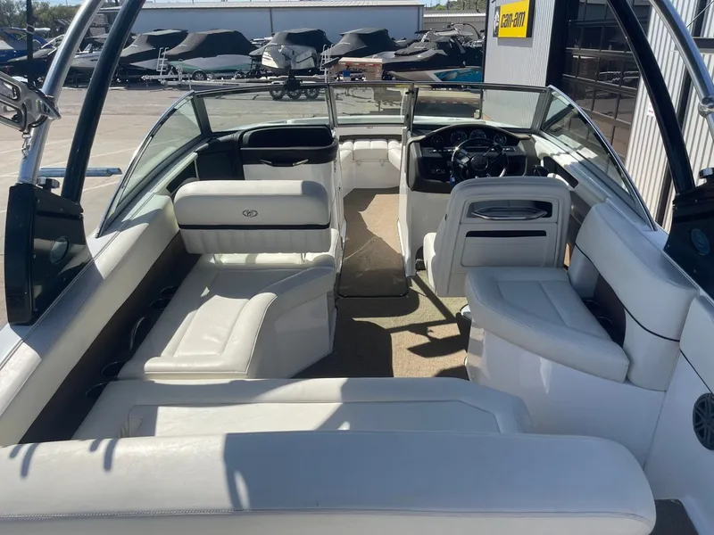 Slide: The Image of Interior of a 2016 Cobalt 24SD boat with white seating. - 10