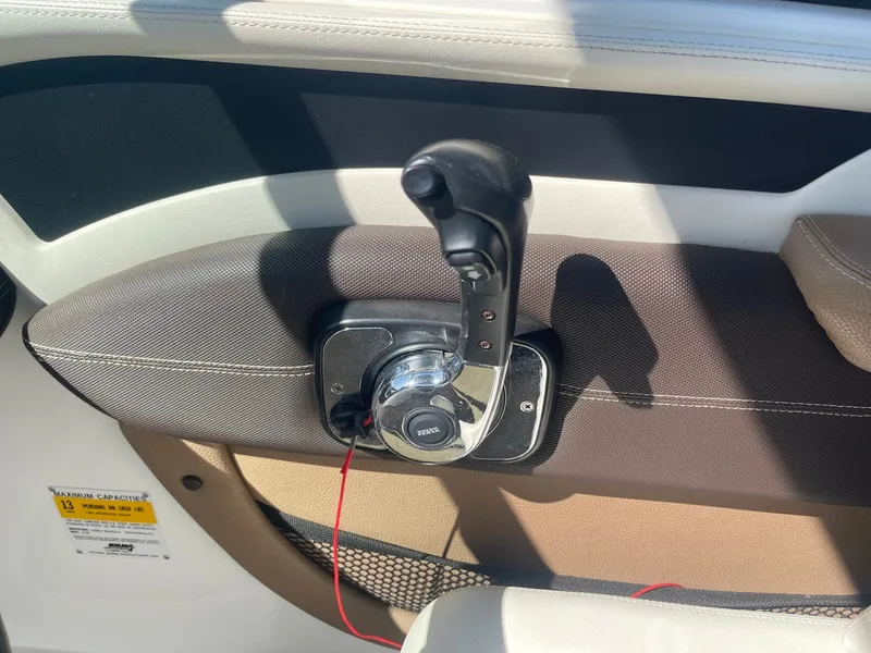 Slide: The Image of Close-up of throttle lever on a 2016 Cobalt 24SD boat. - 12