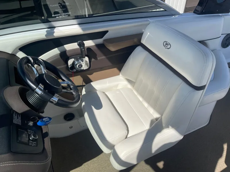 Slide: The Image of Interior of a 2016 Cobalt 24SD boat with white seating. - 14