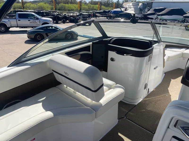 Slide: The Image of Interior of a 2016 Cobalt 24SD boat with white seating. - 15