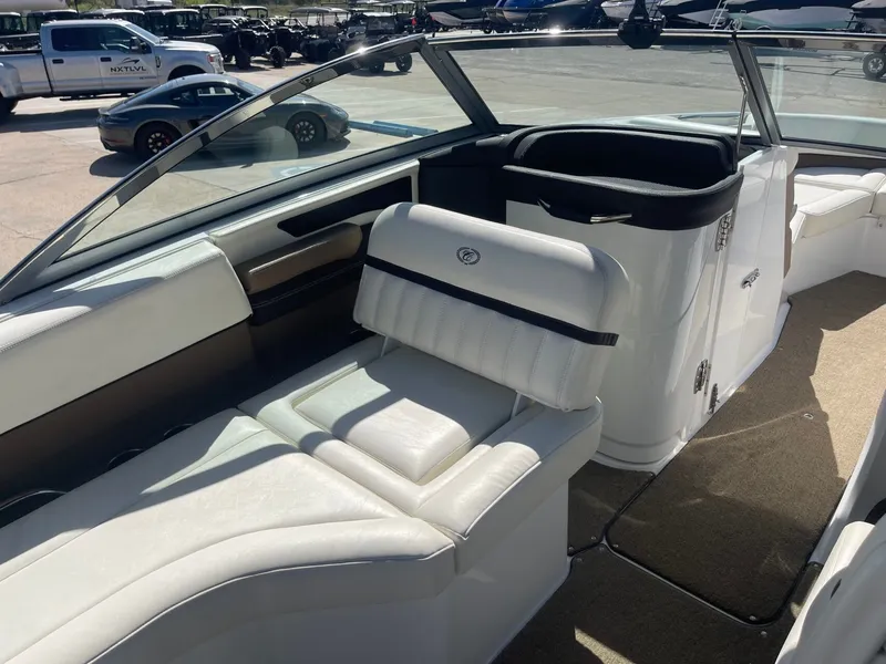 Slide: The Image of Interior of a 2016 Cobalt 24SD boat with white seating. - 16