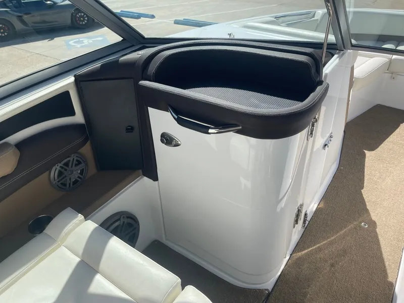 Slide: The Image of Interior of a 2016 Cobalt 24SD boat with seating area. - 17