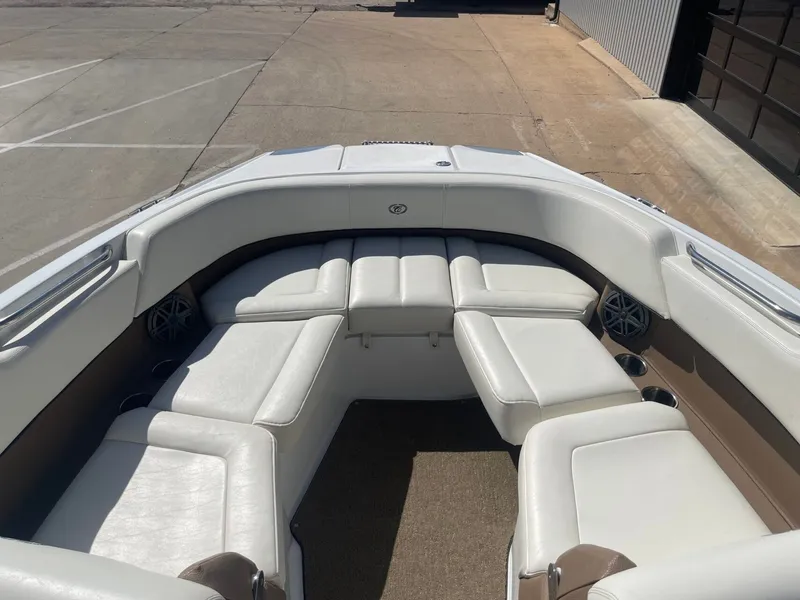 Slide: The Image of Interior of a 2016 Cobalt 24SD boat with white leather seating. - 20
