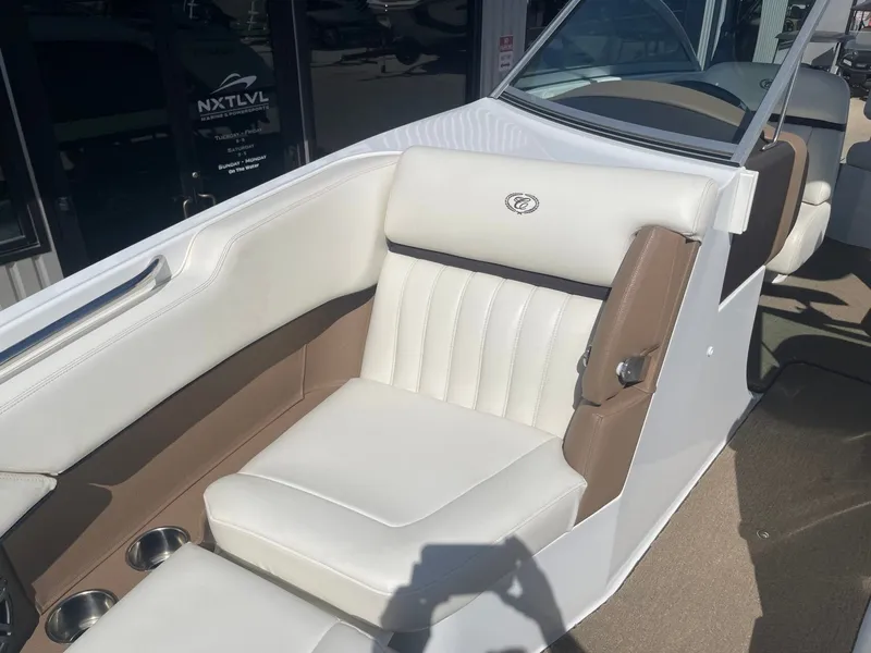 Slide: The Image of Interior of a 2016 Cobalt 24SD boat with white leather seats. - 21