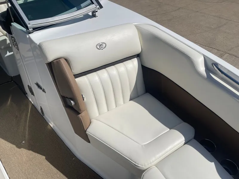 Slide: The Image of Interior of a 2016 Cobalt 24SD boat with white seating. - 22