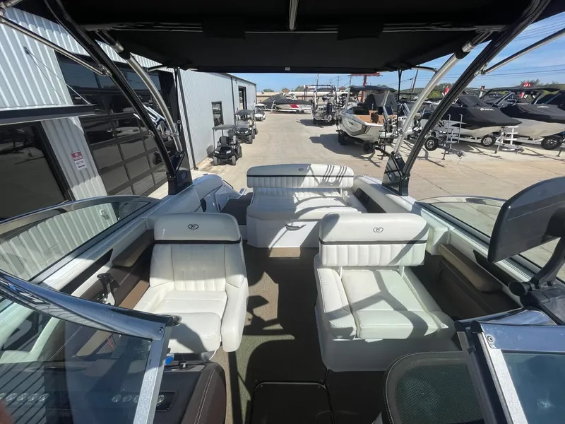 Slide: The Image of Interior of a 2016 Cobalt 24SD boat with white seating. - 24