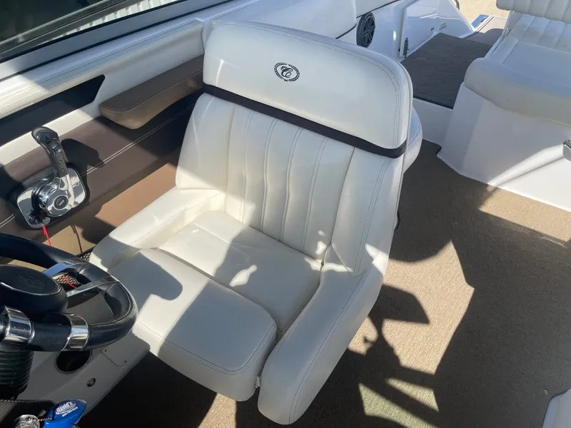 Slide: The Image of Interior of a 2016 Cobalt 24SD boat with white seating. - 25