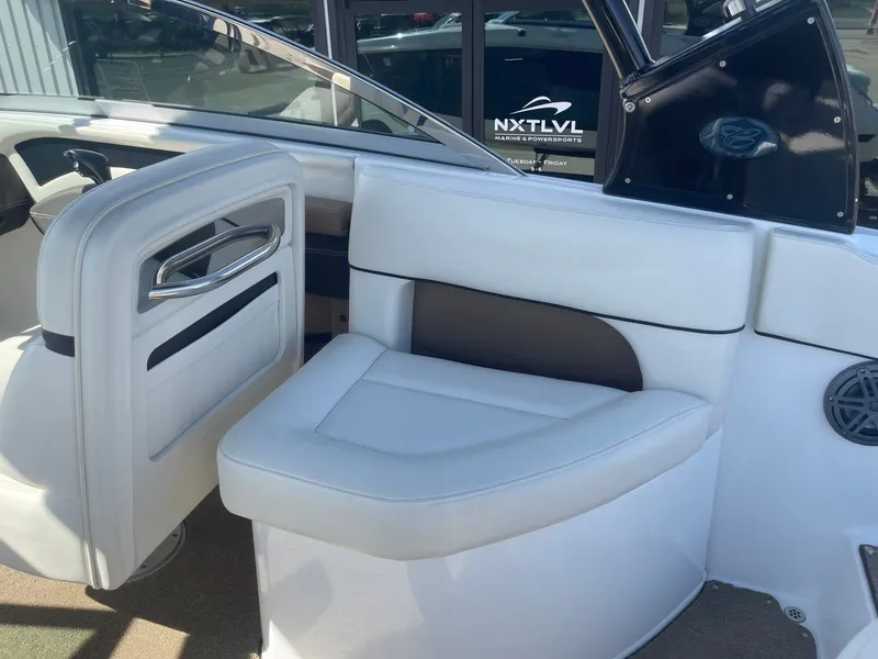 Slide: The Image of Interior of a 2016 Cobalt 24SD boat with white seating. - 26