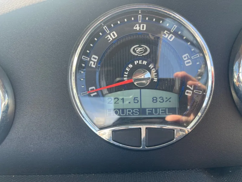 Slide: The Image of 2016 Cobalt 24SD speedometer showing 221.5 hours and 83% fuel. - 27