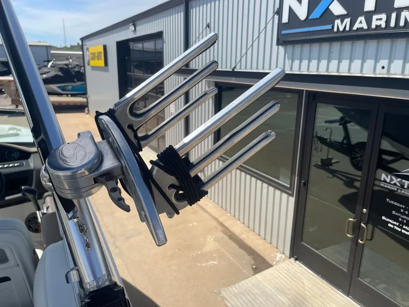 Slide: The Image of Cobalt 24SD 2016 boat with wakeboard rack outside a marine shop. - 28