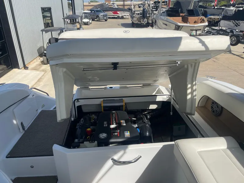 Slide: The Image of Engine compartment of a 2016 Cobalt 24SD boat outdoors. - 33