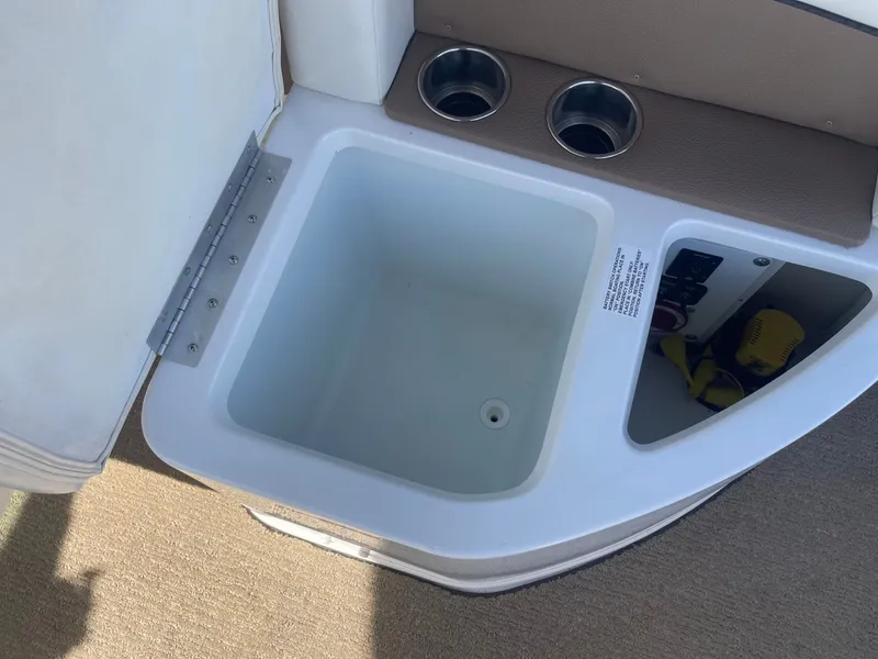 Slide: The Image of Cobalt 24SD 2016 boat cooler with cup holders. - 36