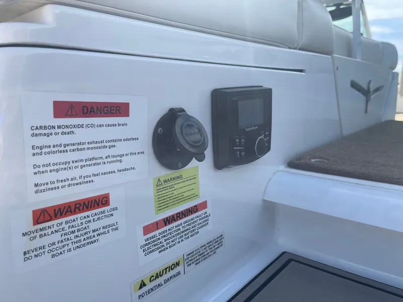 Slide: The Image of Warning labels on a 2016 Cobalt 24SD boat. - 39