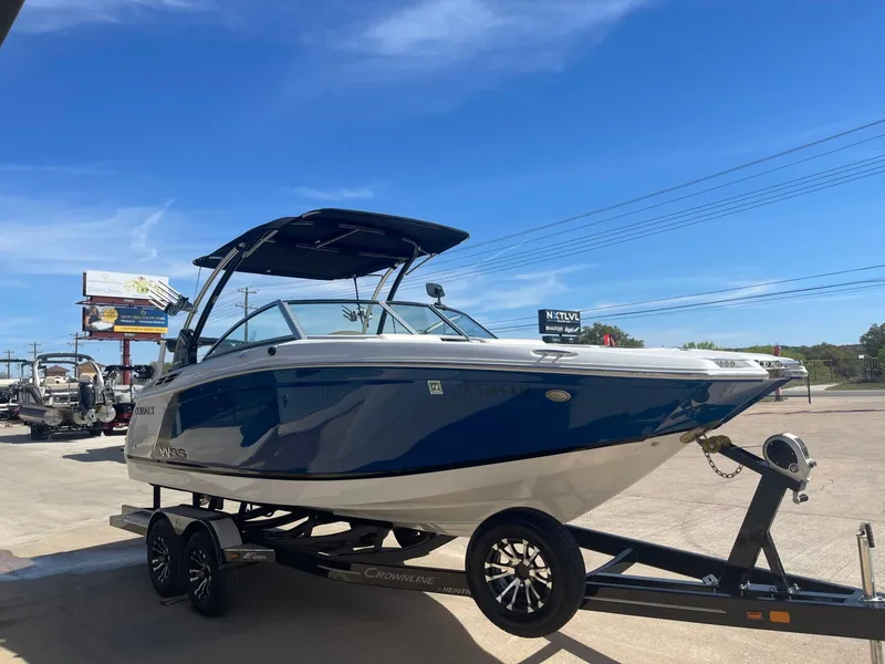 Slide: The Image of 2016 Cobalt 24SD boat on trailer under sunny skies. - 4
