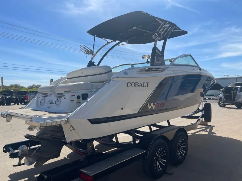 Slide: The Image of 2016 Cobalt 24SD boat on trailer under sunny skies. - 5