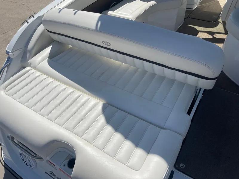 Slide: The Image of Rear seating of a 2016 Cobalt 24SD boat with white upholstery. - 8