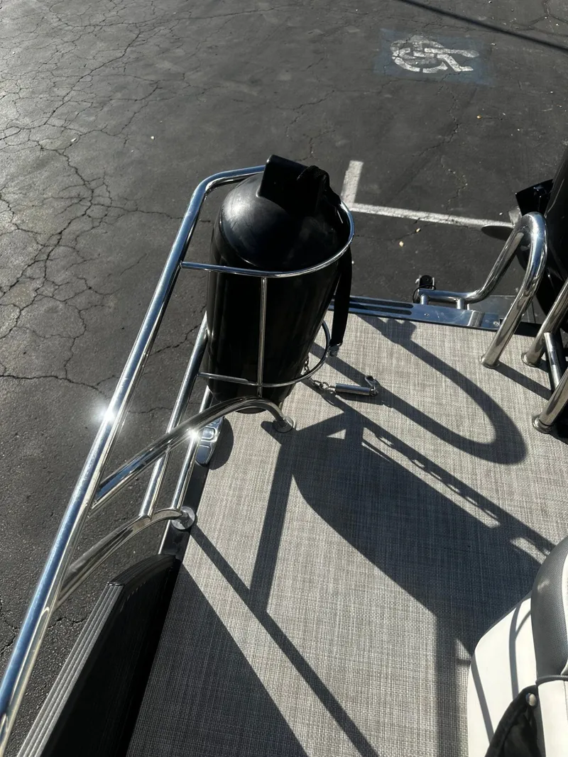 Slide: The Image of 2022 Harris Sunliner 250 boat with stainless steel railing. - 14
