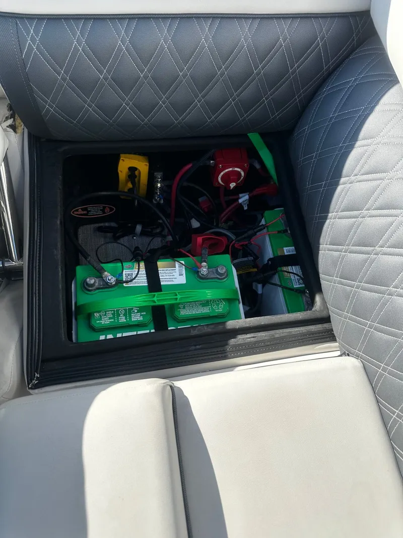 Slide: The Image of Battery compartment of a 2022 Harris Sunliner 250 boat. - 21