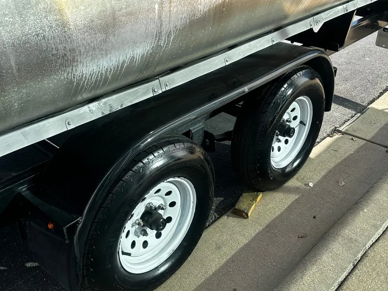 Slide: The Image of Harris Sunliner 250 2022 trailer wheels on sidewalk. - 23