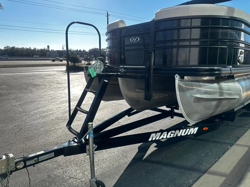 Slide: The Image of 2022 Harris Sunliner 250 pontoon boat on Magnum trailer. - 7
