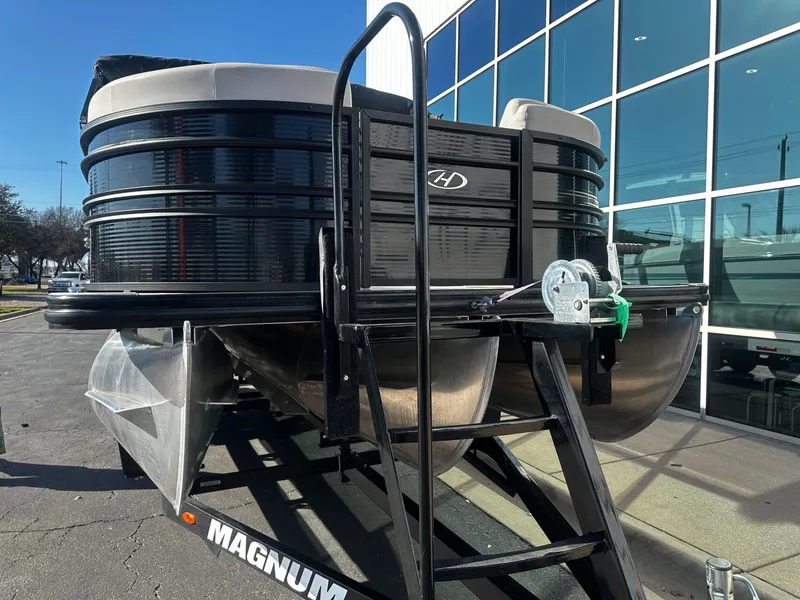 Slide: The Image of 2022 Harris Sunliner 250 pontoon boat on a trailer. - 8