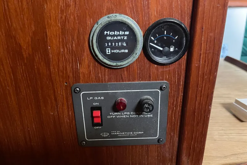 Slide: The Image of Control panel on Irwin 37 Mk V boat with hour meter and fuel gauge. - 14
