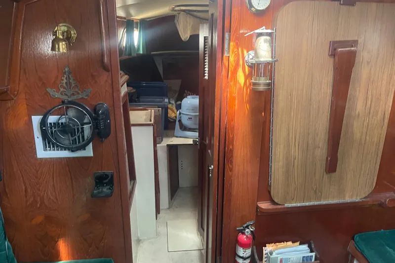 Slide: The Image of Interior of Irwin 37 Mk V sailboat with wood paneling and nautical decor. - 18