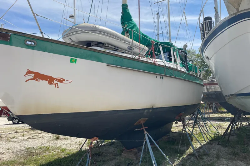 Slide: The Image of Sailboat Irwin 37 Mk V on stands, featuring a fox decal on the hull. - 2
