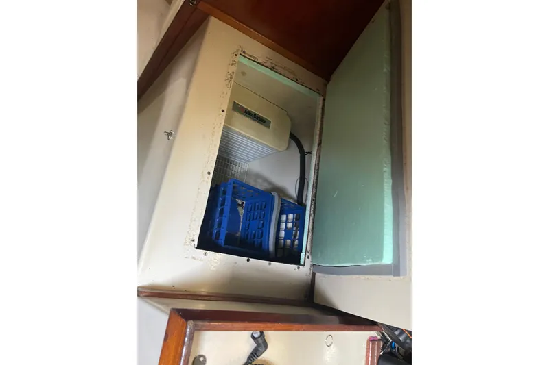 Slide: The Image of Open storage compartment on Irwin 37 Mk V boat with blue crate inside. - 22