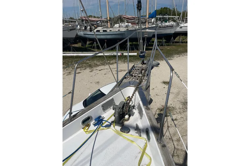 Slide: The Image of Bow view of Irwin 37 Mk V sailboat on land, surrounded by other boats. - 3