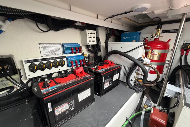 Slide: The Image of Engine room of 2025 Formula 380 Super Sport Crossover OB with batteries and fire suppression system. - 13