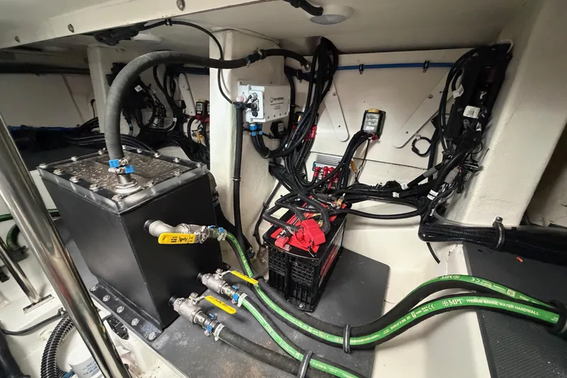 Slide: The Image of Engine compartment of 2025 Formula 380 Super Sport Crossover OB with wiring and components. - 16