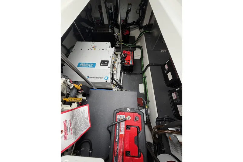 Slide: The Image of Engine compartment of 2025 Formula 380 Super Sport Crossover OB with Seakeeper 3 stabilizer. - 19