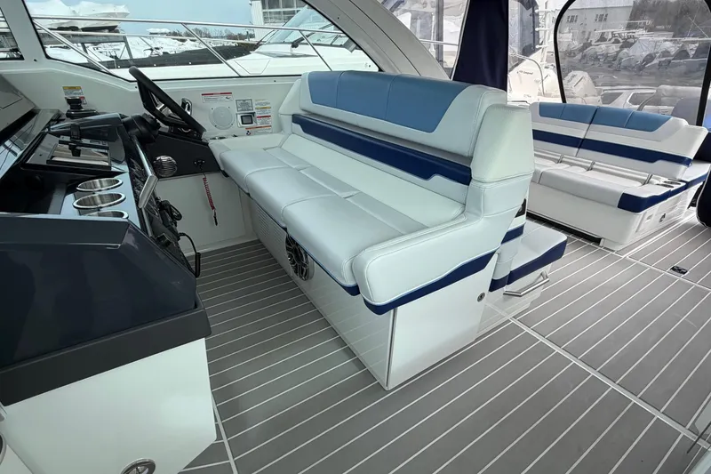 Slide: The Image of 2025 Formula 380 Super Sport Crossover OB interior with sleek seating and modern helm design. - 25