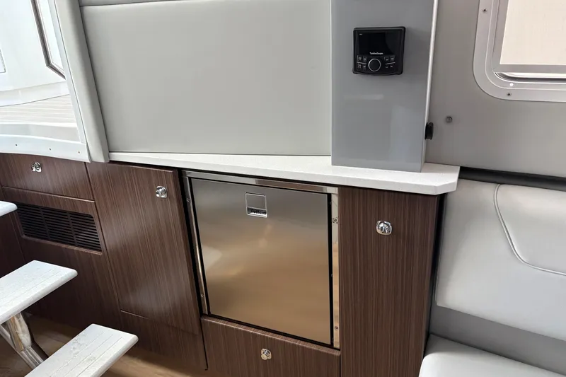 Slide: The Image of 2025 Formula 380 Super Sport Crossover OB interior with sleek cabinetry and modern appliances. - 30