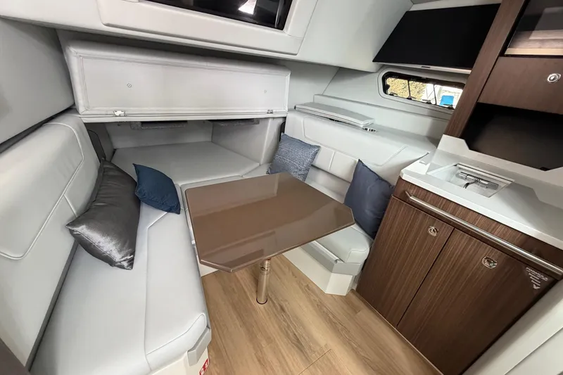 Slide: The Image of Luxurious interior of 2025 Formula 380 Super Sport Crossover OB with modern seating and table. - 32