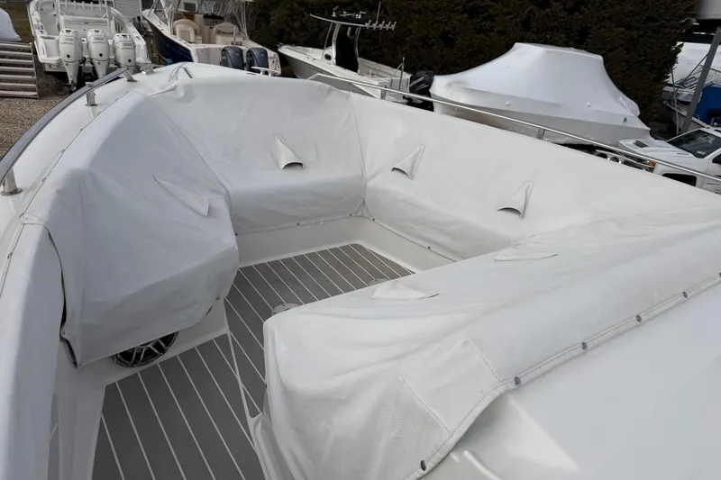 Slide: The Image of 2025 Formula 380 Super Sport Crossover OB boat with covered seating area. - 41