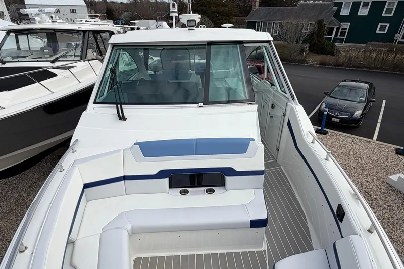 Slide: The Image of 2025 Formula 380 Super Sport Crossover OB boat with sleek design and spacious seating. - 43