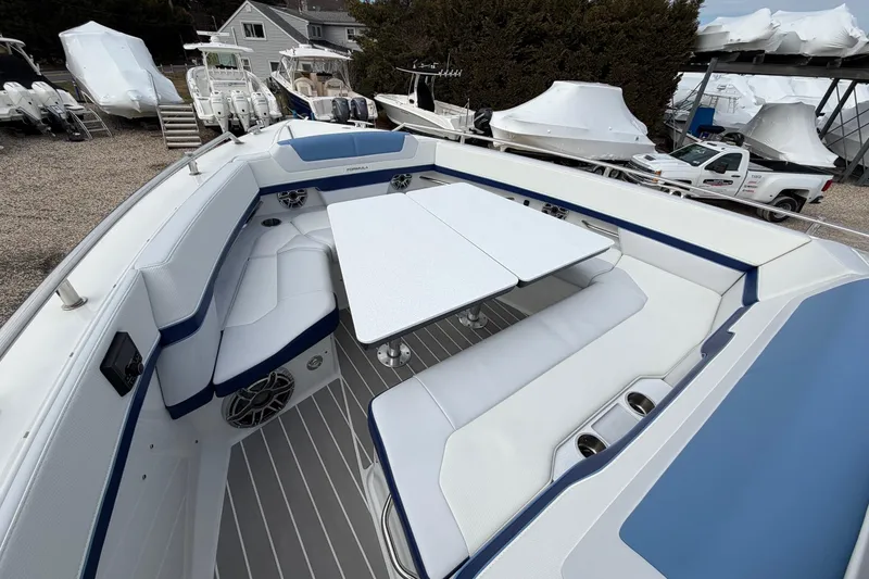 Slide: The Image of 2025 Formula 380 Super Sport Crossover OB boat interior with seating and table. - 47