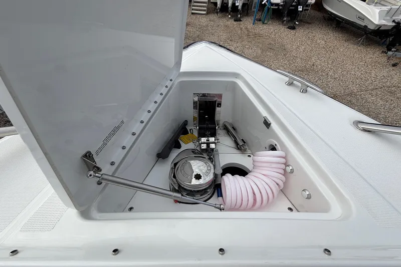 Slide: The Image of Open storage compartment on 2025 Formula 380 Super Sport Crossover OB boat. - 48